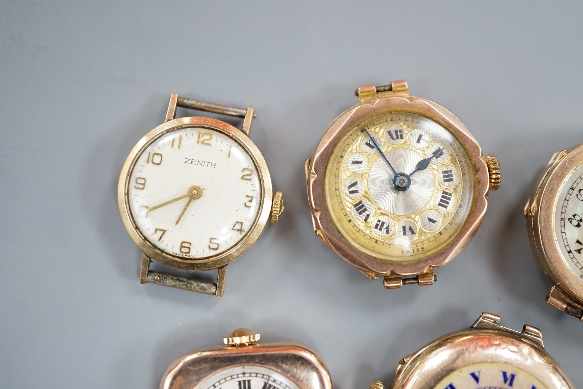 Four assorted lady's mainly early to mid 20th century 9ct gold manual wind wrist watches, including Vertex & Zenith and one other yellow metal wrist watch, all lacking straps.